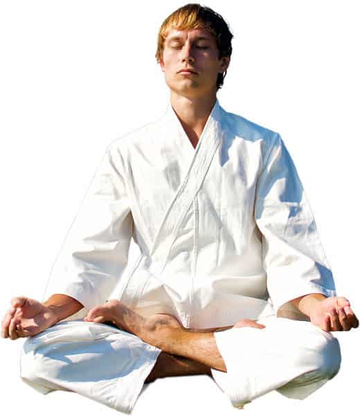 Martial Arts Lessons for Adults in Huntington Station NY - Young Man Thinking and Meditating in White